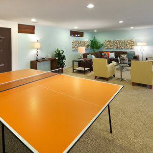 Photo of a contemporary fully buried basement in DC Metro with blue walls, carpet and no fireplace.