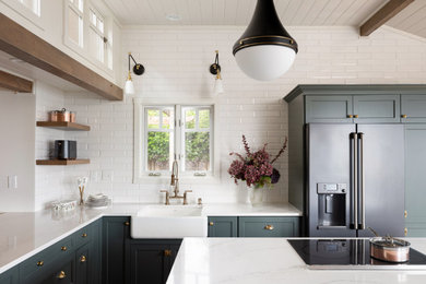 Inspiration for a large timeless l-shaped medium tone wood floor, brown floor and shiplap ceiling open concept kitchen remodel in Seattle with a farmhouse sink, shaker cabinets, green cabinets, quartz countertops, white backsplash, subway tile backsplash, stainless steel appliances, an island and white countertops