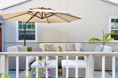 Large transitional backyard patio photo in Seattle with decking and a gazebo
