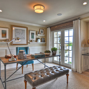 Photo of a coastal home office and library in Los Angeles with beige walls and medium hardwood flooring.