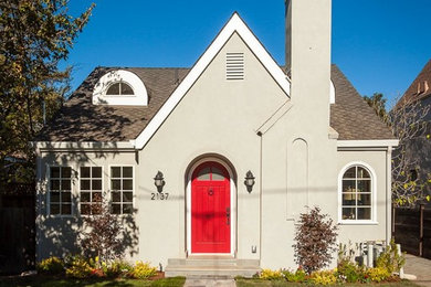 Example of a small classic beige two-story stucco gable roof design in San Francisco