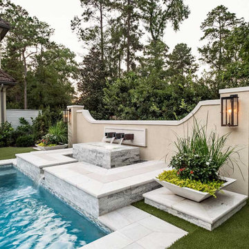 Rectangular pool, covered patio and kitchen, outdoor shower, landscaping