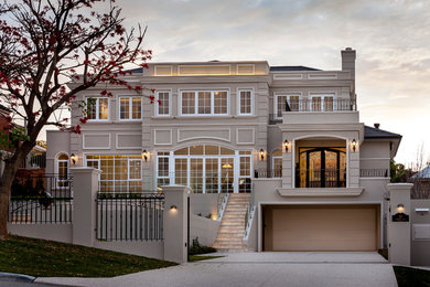 Design ideas for a large traditional three-storey beige exterior in Perth.
