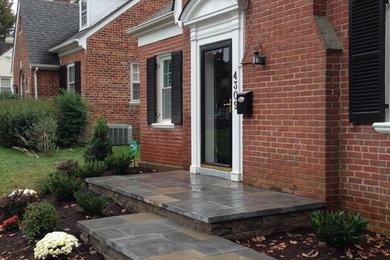 Large traditional red one-story brick gable roof idea in Richmond