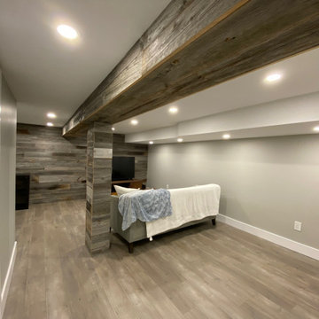 Basement renovation with reclaimed barn wood feature
