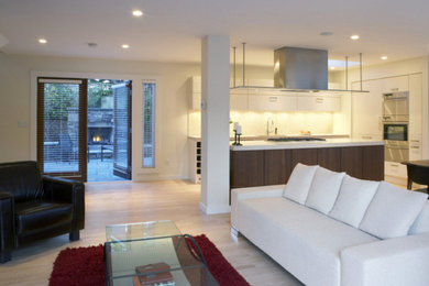 Large trendy formal and open concept light wood floor living room photo in Boston with white walls, no fireplace and no tv