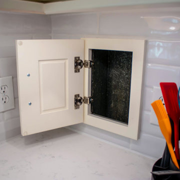 Custom Two-Toned Green and White Kitchen with Laventa Carrara Quartz Countertops