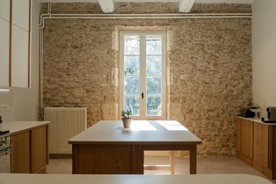 Kitchen - modern kitchen idea with white backsplash, an island and white countertops
