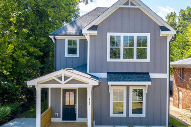 Mid-sized arts and crafts blue two-story wood exterior home photo in Raleigh with a shingle roof