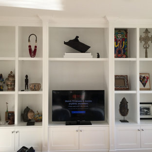 Photo of a medium sized traditional open plan home cinema in Miami with white walls, a built-in media unit and medium hardwood flooring.