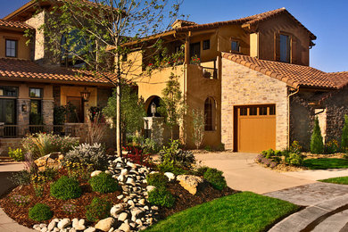 Design ideas for a mid-sized mediterranean partial sun courtyard stone outdoor basketball/tennis/multi-game court in Denver for summer.