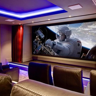 Example of a large minimalist enclosed carpeted and beige floor home theater design in Bridgeport with beige walls and a projector screen
