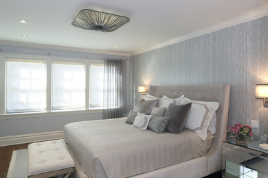 Example of a transitional bedroom design in New York with gray walls