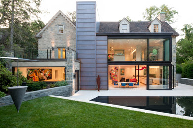 Huge minimalist gray three-story mixed siding exterior home photo in DC Metro with a shingle roof