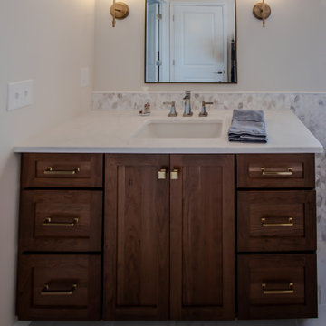 Luxury Spa Bathroom with Natural Warm Vanities, Quartz Countertop, Tiled Shower