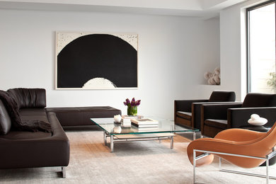 Photo of a large modern open concept living room in Boston with white walls.