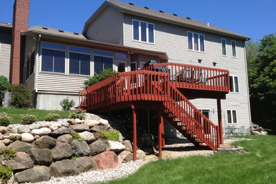 Inspiration for a mid-sized backyard deck remodel in Other with no cover