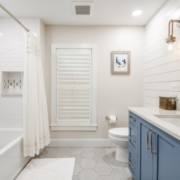 Tile design breaks up the white subway tile and creates visual interest.