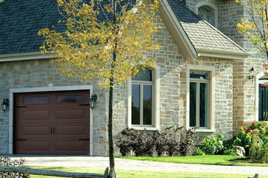 Garage - mid-sized traditional attached one-car garage idea in Cedar Rapids