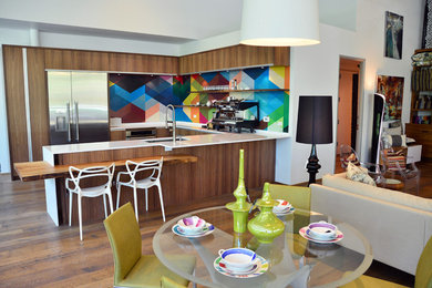 Trendy eat-in kitchen photo in Austin with an undermount sink, flat-panel cabinets, dark wood cabinets and stainless steel appliances