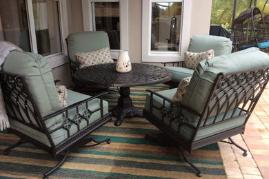Inspiration for a mid-sized coastal backyard brick patio remodel in Jacksonville with a roof extension