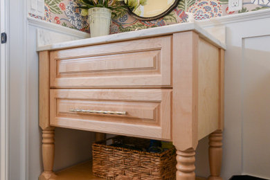 Inspiration for a coastal powder room remodel in Other with light wood cabinets and a freestanding vanity