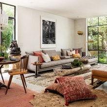 Layering persian and antique rugs