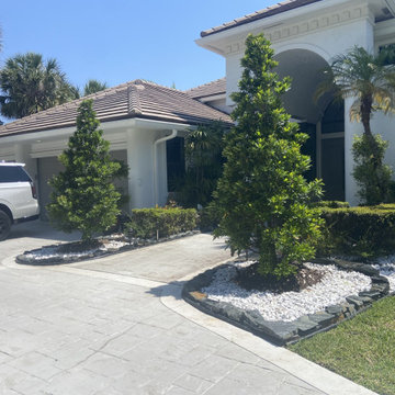 Elegant Front Yard Transformation: Modern Hardscape & Lush Greenery