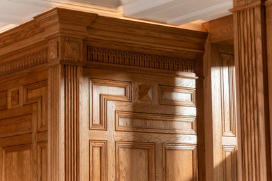 Inspiration for a large traditional home office in Gloucestershire with a stone fireplace surround, wood walls and feature lighting.