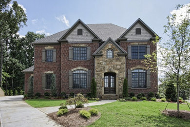 Large traditional gray three-story mixed siding exterior home idea in Atlanta