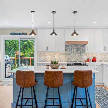 Serene Blue Oasis: Kitchen Renovation with White Perimeter and Meditation-Inspir