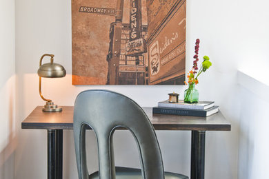 Home office - contemporary freestanding desk dark wood floor home office idea in Kansas City with white walls