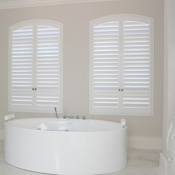 Arched White Shutters with Invisable tilt