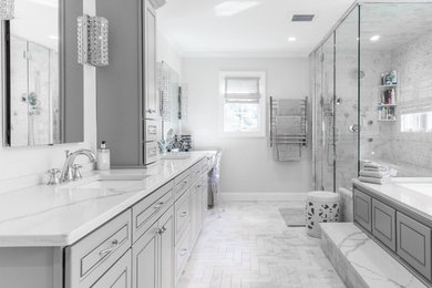 Inspiration for a large contemporary master white tile and marble tile marble floor and white floor corner shower remodel in Richmond with raised-panel cabinets, gray cabinets, an undermount tub, gray walls, an undermount sink, marble countertops and a hinged shower door