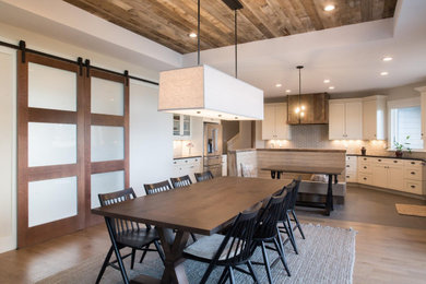 Banquette, Barn Wood Ceiling, Doors, Range Hood, and Trim Work by Black Diamond