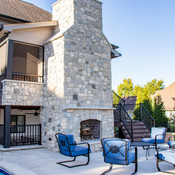 Outdoor Room with a Double Fireplace Feature