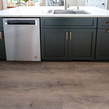 3 Finishes on Kitchen Cabinetry with Galley Workstation in Island and Wine Bar