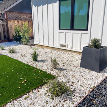 Modern Low-Maintenance Front Yard with Custom Fence and Artificial Turf