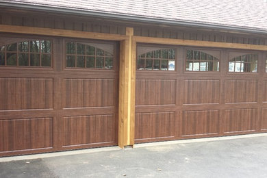 Example of a mid-sized classic attached three-car garage design in Orange County