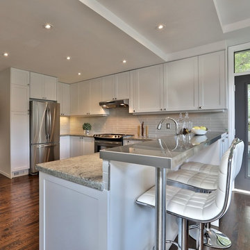 Shaker style kitchen and granite countertop in Toronto