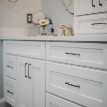 Stylish pull handle hardware for bathroom cabinetry.