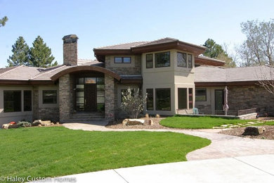 Mid-sized trendy multicolored two-story mixed siding exterior home photo in Austin with a hip roof