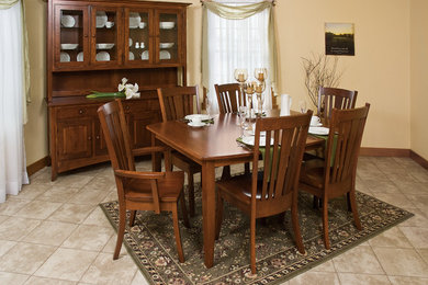 Enclosed dining room - mid-sized traditional ceramic tile and beige floor enclosed dining room idea in San Diego with yellow walls and no fireplace
