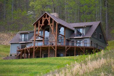 Example of a large mountain style three-story mixed siding exterior home design in Other with a shingle roof