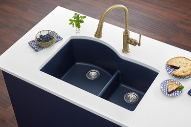 Inspiration for a kitchen remodel in Chicago with a double-bowl sink, blue cabinets and white countertops