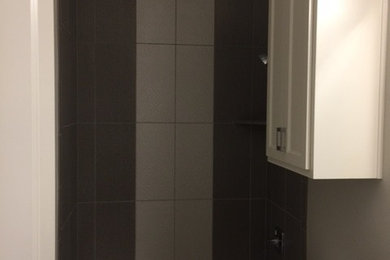 Bathroom - mid-sized contemporary 3/4 bathroom idea in Dallas with recessed-panel cabinets, white cabinets, a two-piece toilet, gray walls, an undermount sink and marble countertops