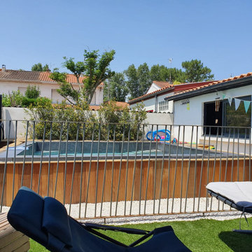 Piscine SPA semi-enterrée à débordement miroir et carreaux de ciment