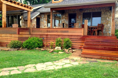 Outdoor kitchen deck - large contemporary backyard outdoor kitchen deck idea in Dallas with a pergola