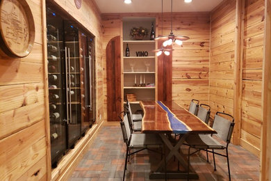 Example of a mountain style wine cellar design in Cedar Rapids