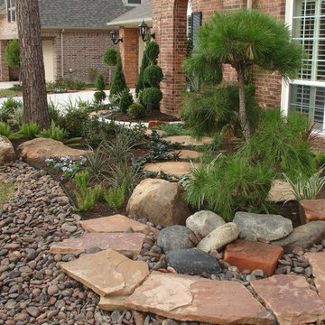 Landscaping with oversize pavers and backyard creek - hkns